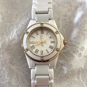 Juicy Couture watch. Beautiful face detail, ceramic strap, new battery